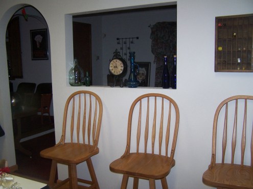The little window to the dining room. Enless possibilities. The clock happens to have faces on both sides!