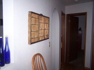 Side view of the printer's type tray and collection of dice.