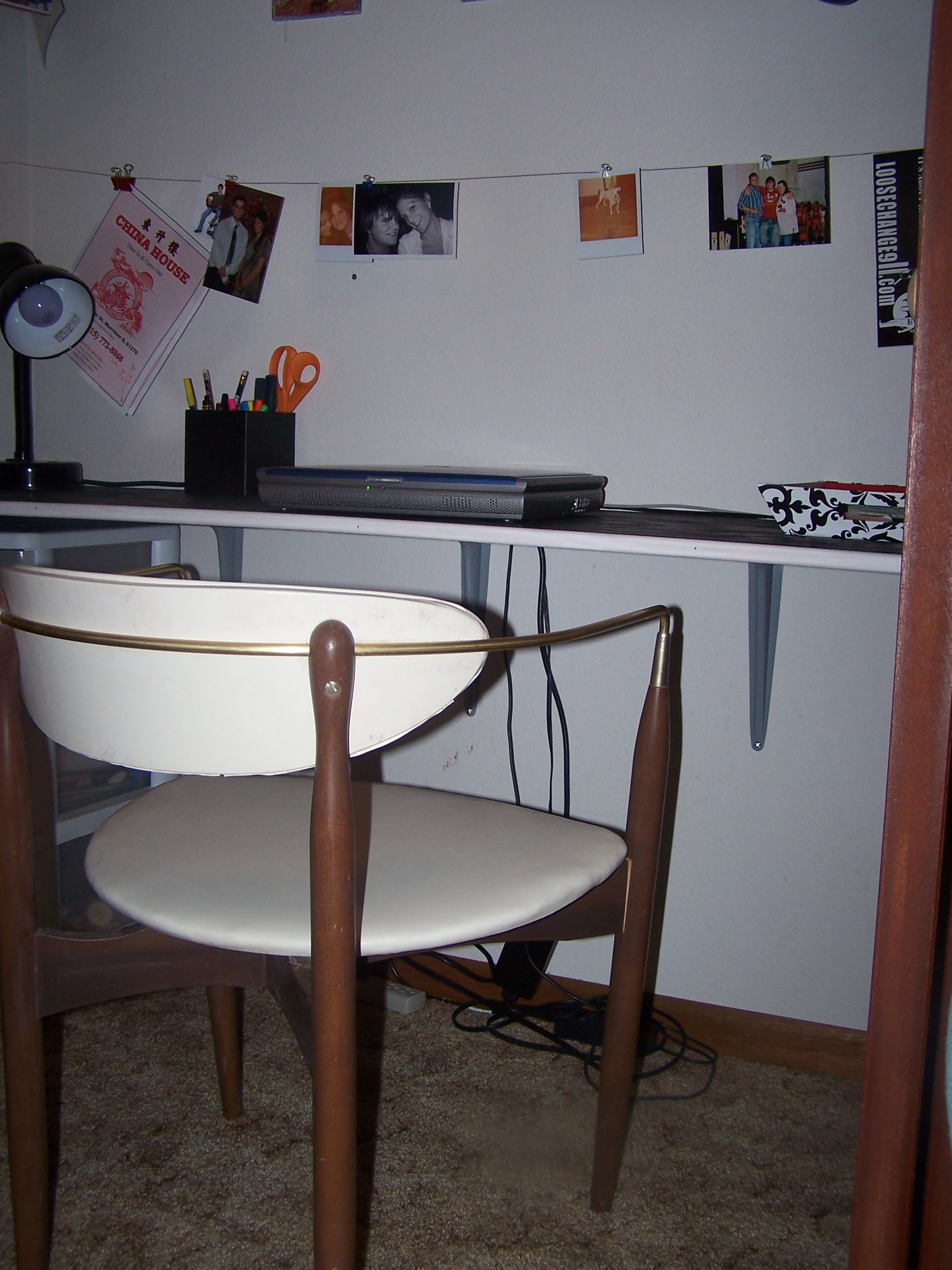 The chair that we are using right now as the desk chair was found in the garbage. I hate to admit that, but it was perfect and I couldn't pass it up! All it needed was a good scrubbing (thank you Magic Eraser!). I thought it was so vintage cute, so I made Tony go swipe it. Gorgeous.