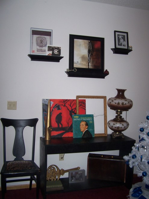 Console table with the shelves above it.  The black chair was a project I redid.