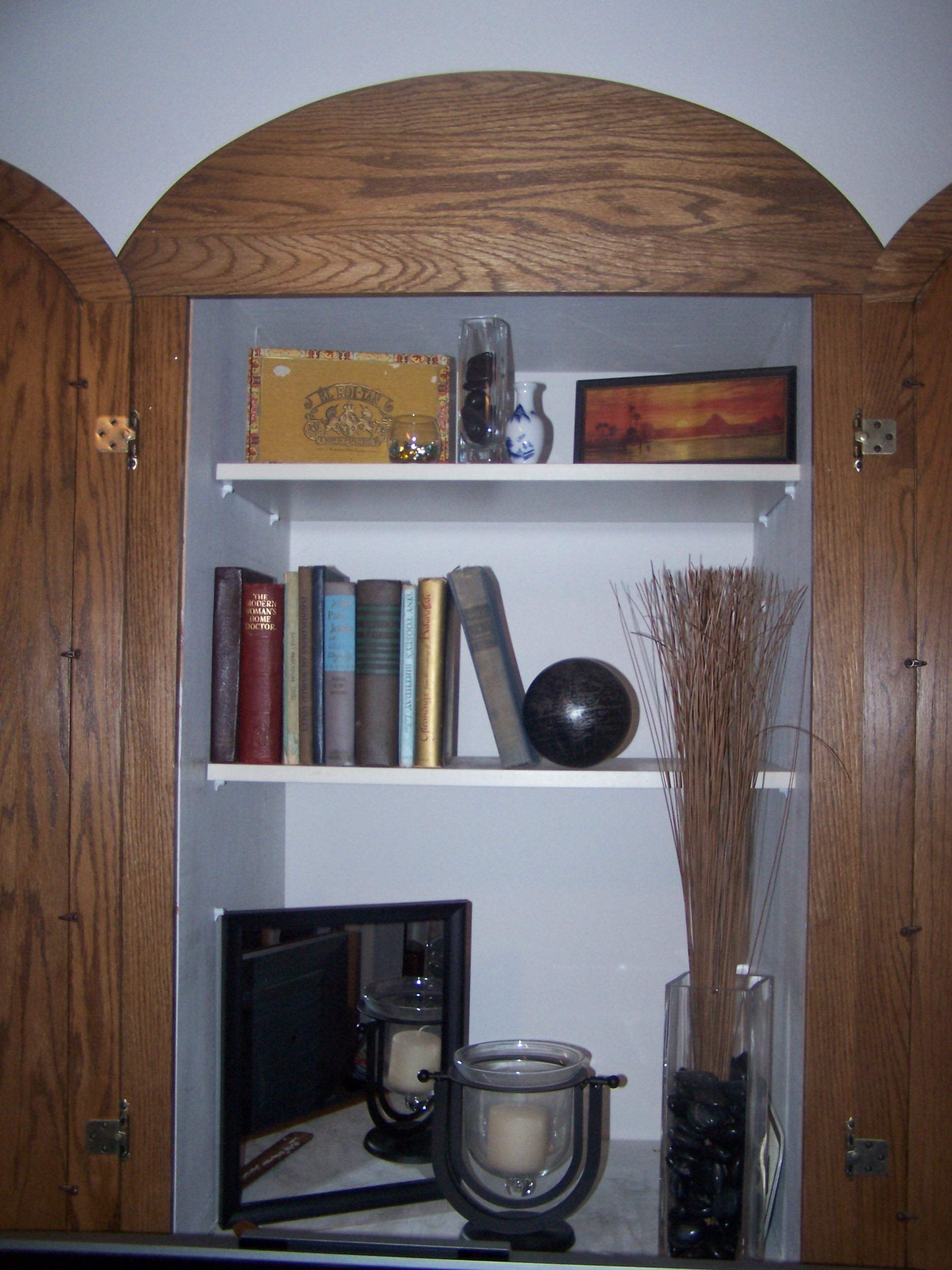 The cigar box in the TV cubbie.