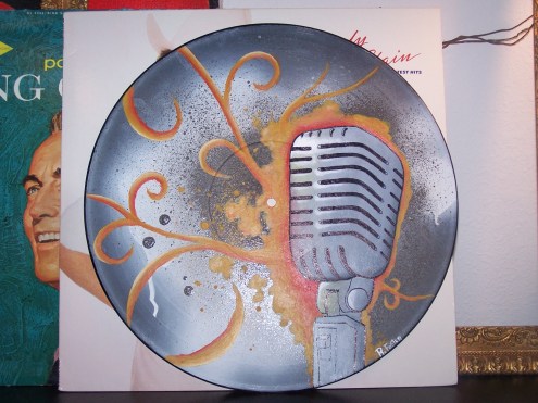 The record is sitting in front of it's cover, as well as other records, just for reference.  Isn't that gorgeous!?