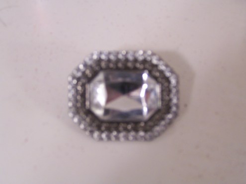 The ring to match the belt on the dress.