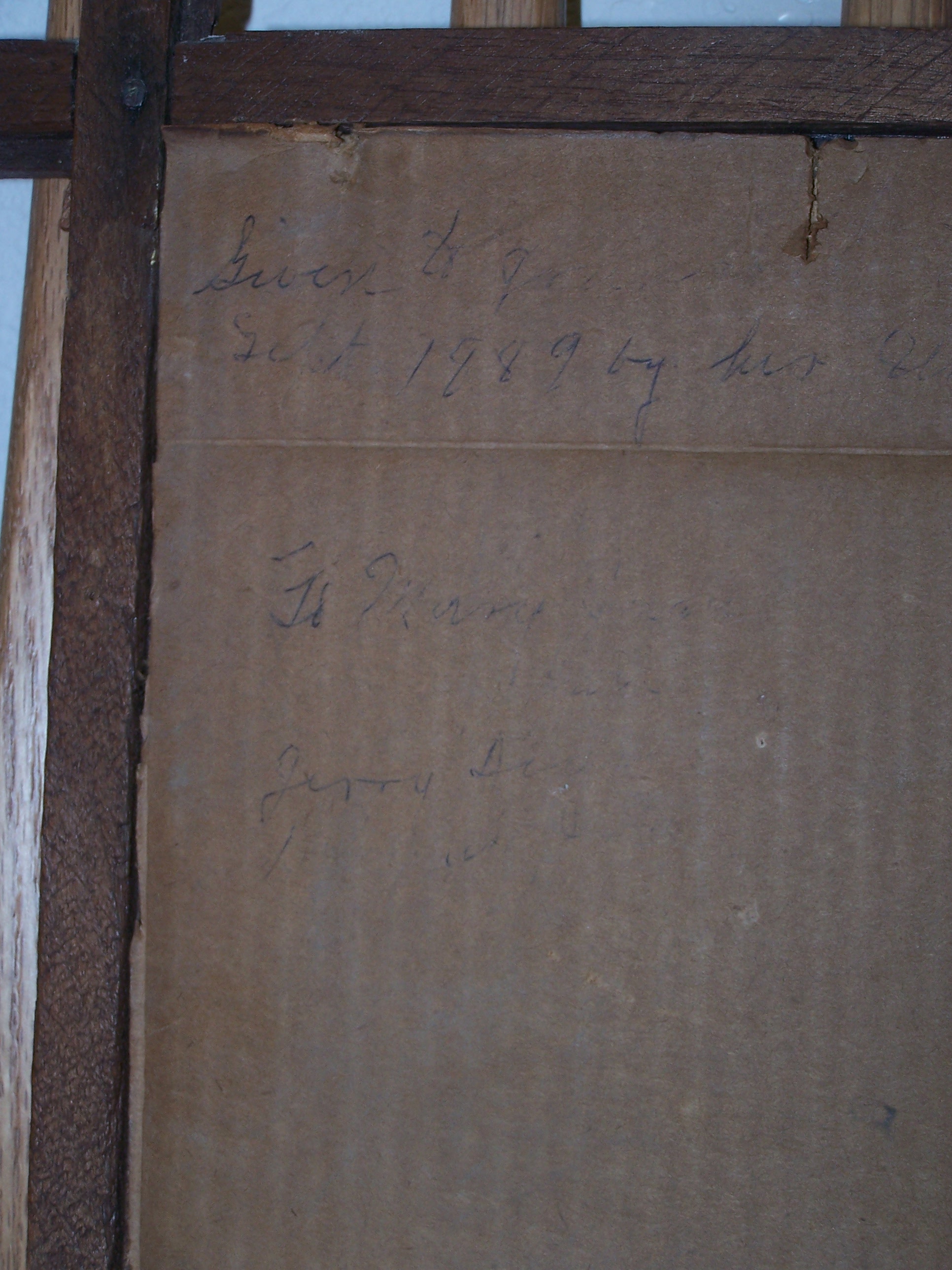 This is the writing on the back of one picture.  We can't make out all of the words, but we can read 1898!  