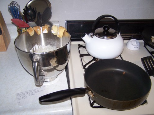 Here I am in the process.  Some of the cookies are hanging on the edge of the bowl.  This is a very good technique for forming the cookies!