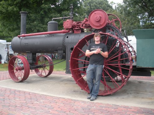 And here is Tony with a very large threshing machine, the main reason for the event!